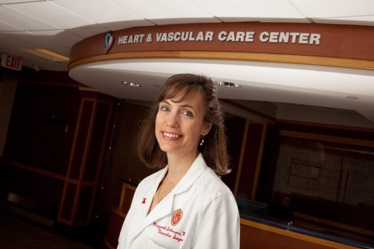 Dr. Schwarze posing in front of a clinic