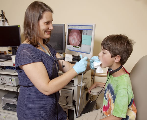Doctor looking in child's mouth