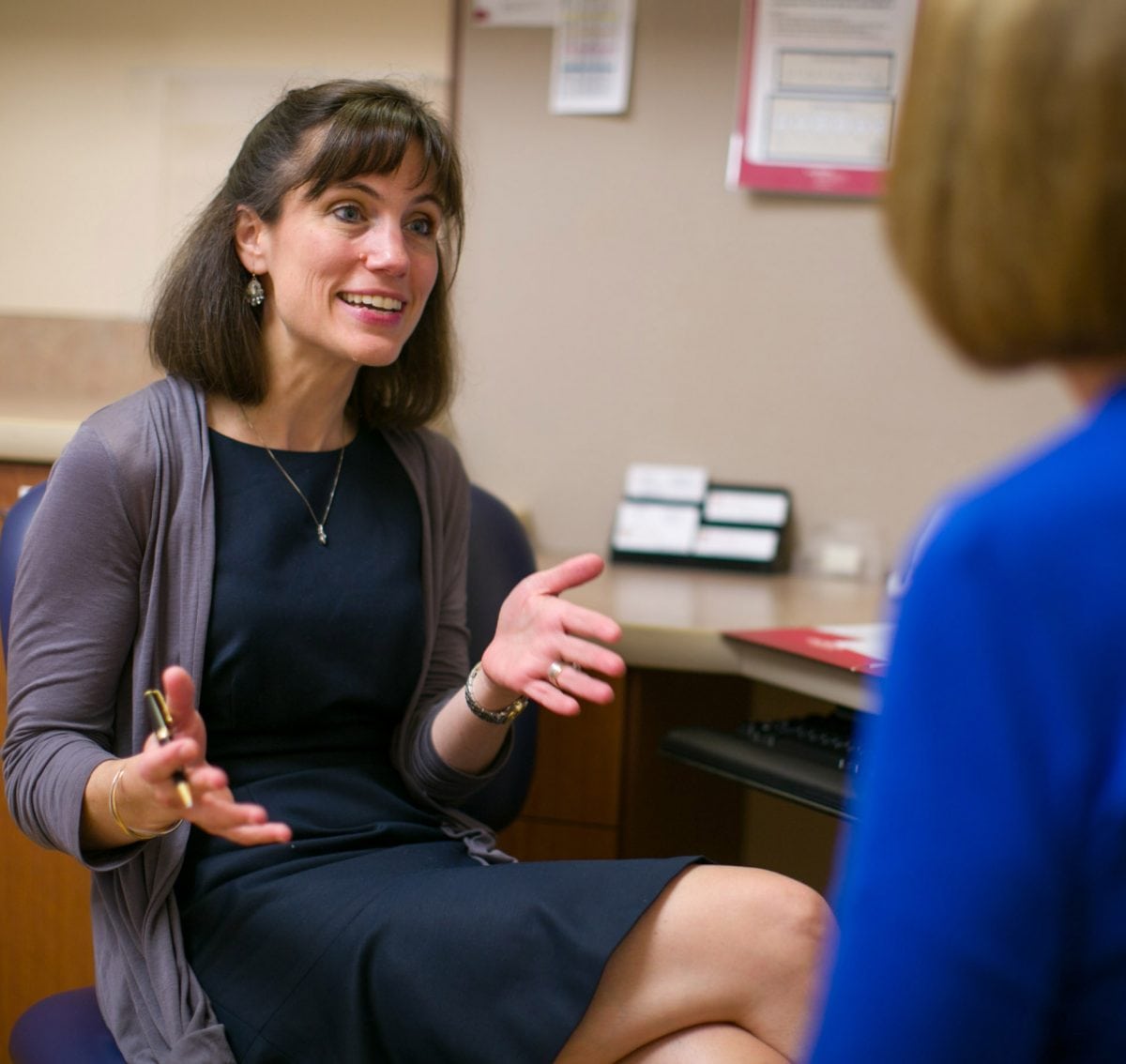 Dr. Schwarze talking to patient