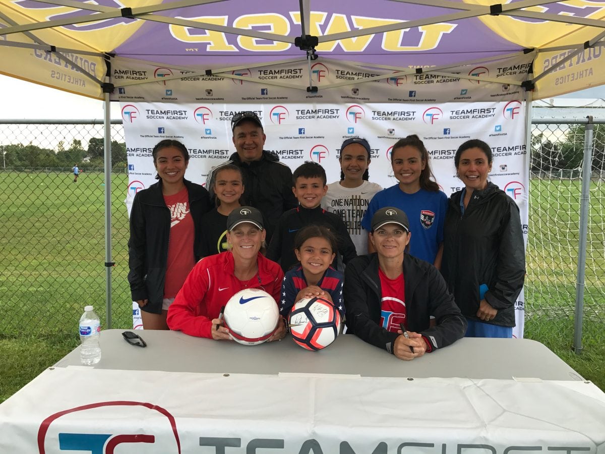 Dr. Kevin Wasco and his 6 children holding soccer ball