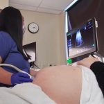 photo of a pregnant patient receiving an ultrasound