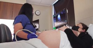 photo of a pregnant patient receiving an ultrasound