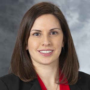 A formal headshot of Nicole Werner, MD, who has long brown hair and a black jacket.