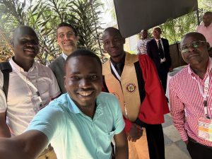 Dr. Saad Sahi and four other people stand together for a selfie 