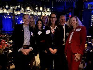 Monica Whetter, Kristie Palovcsik, Jen Sankbeil, Cheryl Bowman, Nicole Jennings, Rick Ziegler, Dr. Rebecca Minter stand together for a picture