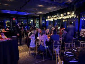Attendees of the Layton Rikkers Surgical Society Alumni Dinner sitting at tables